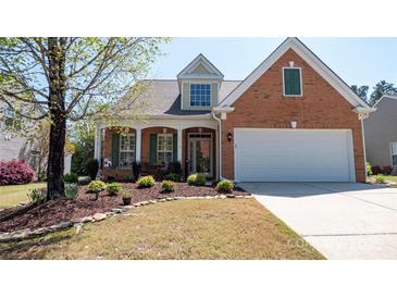 Attractive brick home with a well-maintained yard, attached garage, and inviting curb appeal at 9319 Kestral Ridge Dr, Charlotte, NC 28269