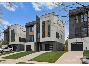 Modern townhomes showcase contemporary architecture and private driveways at 215 Keswick Ave, Charlotte, NC 28206