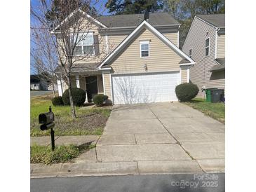 Charming two-story home with a two car garage, manicured lawn, and a traditional mailbox at 4831 Belmar Place Rd, Charlotte, NC 28269