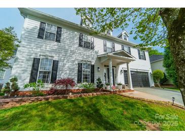 Charming two-story home with white siding, black shutters, and well-manicured landscaping at 117 Middleton Pl, Mooresville, NC 28117