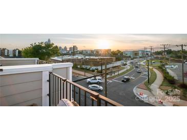 Rooftop view overlooking city streets with sunset in background at 224 Parkwood Ave, Charlotte, NC 28206