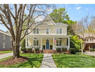 Charming two-story home featuring a welcoming front porch and a beautifully landscaped front yard at 2569 Lower Assembly Dr, Fort Mill, SC 29708