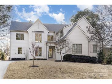 Stunning white painted brick two-story home with an immaculate yard at 510 Poindexter Dr, Charlotte, NC 28209