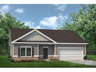 Charming one-story home with a covered porch, attached garage, and beautiful landscaping at 6215 Honor Ave, Midland, NC 28107
