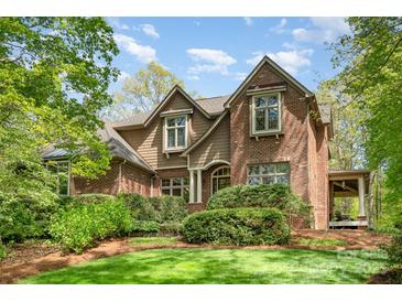 Charming brick home with manicured lawn and mature landscaping offers classic curb appeal at 1116 Landons Ct, China Grove, NC 28023