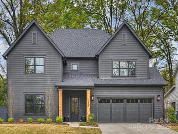 Stunning two-story home featuring a gray exterior, gabled roof, and manicured front yard at 1523 Saint George St, Charlotte, NC 28205