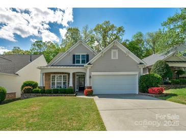Charming home featuring a manicured lawn, lovely landscaping, and a two-car garage at 2136 Ashley River Rd, Waxhaw, NC 28173
