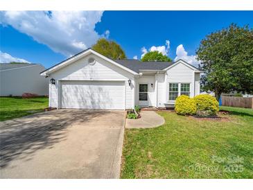 Charming single-story home with manicured lawn, well-kept landscaping, and an attached two-car garage at 4700 Aldersbrook Dr, Monroe, NC 28110