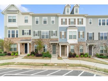 Charming townhomes with stone accents, varied siding colors, and inviting front entrances at 9914 Ainslie Downs St, Charlotte, NC 28273