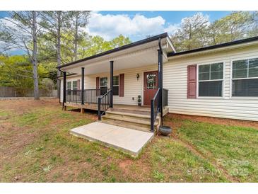 Inviting front porch with black railings and room for seating at 1957 Beth Haven Church Rd, Denver, NC 28037
