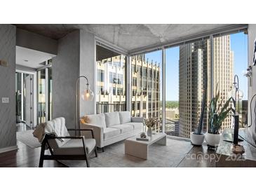 Bright living room with floor-to-ceiling windows and cityscape views at 210 N Church St # 3507, Charlotte, NC 28202