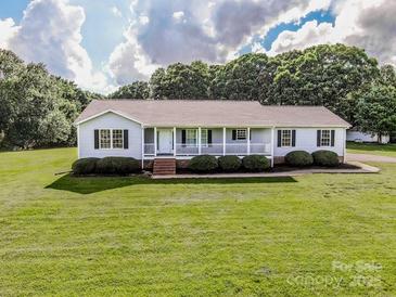 Charming ranch-style home with well-manicured lawn and inviting front porch at 2811 Saint James Church Rd, Denver, NC 28037