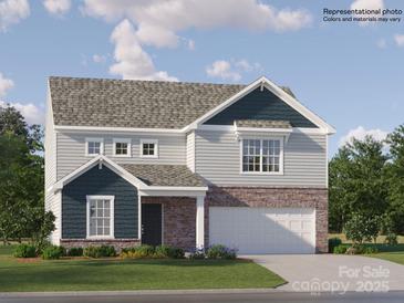Charming two-story home with stone accents, light siding, and a well-manicured lawn in a Gathering-friendly neighborhood at 1202 Blackburn Cir, Edgemoor, SC 29712