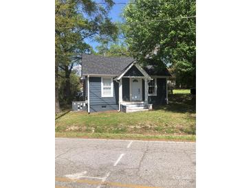 Charming single-story home with grey siding, white trim, and a well-maintained front yard at 401 Plymouth St, Kannapolis, NC 28083