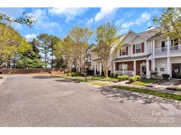 Charming townhomes with manicured lawns and colorful landscaping, showcasing a well-maintained community at 4517 Sabin St, Rock Hill, SC 29732