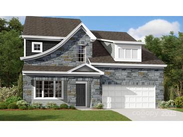 Charming two-story home showcasing stone accents and a well-manicured lawn in a desirable neighborhood at 1235 Yellow Springs Dr, Huntersville, NC 28078