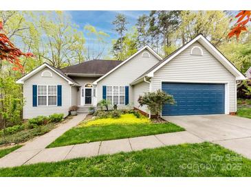 Charming single-story home with a well-maintained lawn, blue shutters, and attached garage on a sunny day at 3505 Mayspring Pl, Charlotte, NC 28269