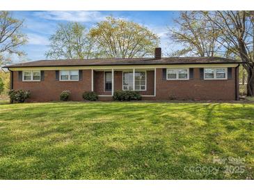 Charming single-story brick home with a well-maintained lawn and inviting curb appeal at 70 Liberty Church Rd, Taylorsville, NC 28681