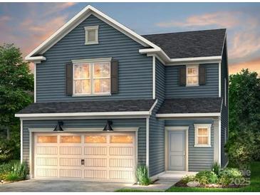 Charming two-story home with attached two car garage and craftsman-style details on a manicured lawn at 14023 Penbury Ln # 371, Charlotte, NC 28278