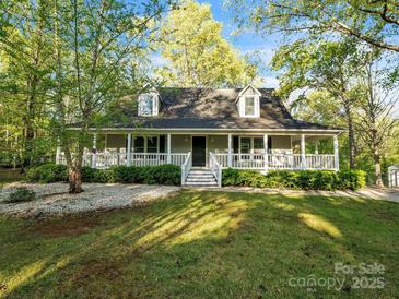 Charming home featuring a spacious porch, dormer windows, and well-maintained landscaping at 2371 Lazy Oak Dr, Lancaster, SC 29720
