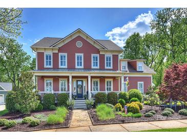 Charming two-story home featuring a welcoming front porch and beautifully landscaped front yard at 727 Bluff Loop Rd, Rock Hill, SC 29730