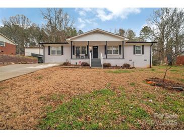 Charming single-story home with a covered front porch and black shutters at 140 Wandering Ln, Bessemer City, NC 28016