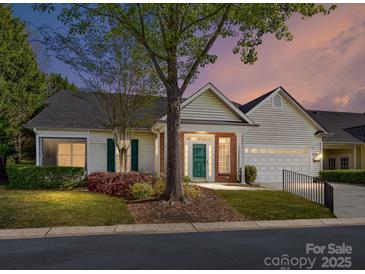 Charming single-story home with a well-maintained lawn and attached garage, perfect for easy living at 11705 Silverado Ln, Charlotte, NC 28277