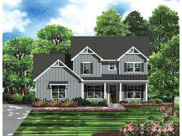 Charming two-story home with gray siding, a covered front porch, and a beautifully landscaped yard at 1504 Baileys Run, Gastonia, NC 28056