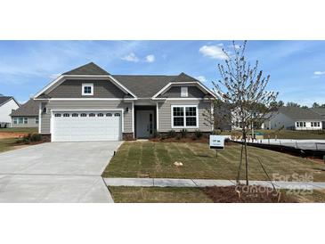 Charming single-story home with a two-car garage and manicured lawn, perfect for comfortable living at 2229 Camber Dr # Cwo0100, Gastonia, NC 28054