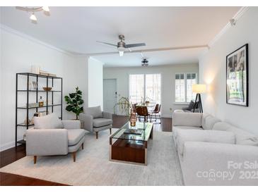Bright living room with white walls, recessed lighting, and hardwood floors at 300 W 5Th St # 136, Charlotte, NC 28202