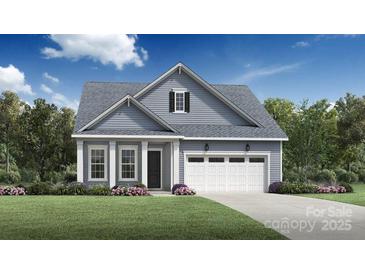 Charming single-Gathering home featuring a well-manicured lawn and attached two car garage at 5325 Mint Harbor Way # 0309, Charlotte, NC 28269