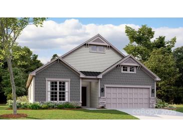 Charming one-story home featuring a two-car garage and a landscaped front yard at 8442 Norman Forest Rd, Lancaster, SC 29720