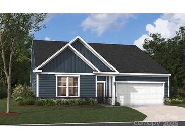 New construction home with blue siding, black roof, white trim, landscaping, and a two-car garage at 2037 Mantle Ridge Dr, Indian Trail, NC 28079