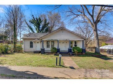 Charming single-story home with a covered front porch, offering curb appeal and outdoor enjoyment at 21 W D St, Newton, NC 28658