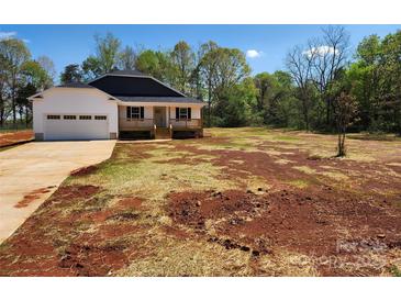 Charming single-story home with a covered front porch and an attached two-car garage on a spacious lot at 4168 S Olivers Cross Rd # 6, Newton, NC 28658