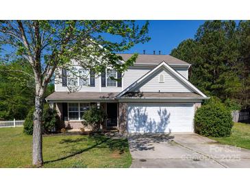 Charming two-story home featuring a two-car garage, brick accents, and a well-manicured lawn at 4707 Hannah Dr, Rock Hill, SC 29732