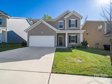 Charming two-story home with a well-maintained lawn and a two-car garage at 113 Fosters Glen Pl, Mooresville, NC 28115