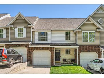 Charming townhome featuring a brick facade, attached garage, and a small front lawn at 3420 Caldwell Ridge Pkwy, Charlotte, NC 28213