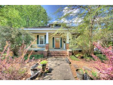 Charming craftsman-style home with inviting front porch and mature landscaping at 1000 E 35Th St, Charlotte, NC 28205