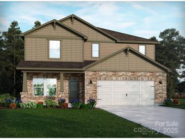 Charming two-story home featuring stone accents, neutral siding, and a well-maintained front lawn at 1216 Morehead Dr, Salisbury, NC 28144
