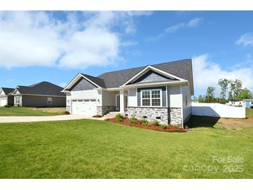 Charming single Gathering home with well maintained lawn and two car garage at 221 Mountain Island Dr, Statesville, NC 28677