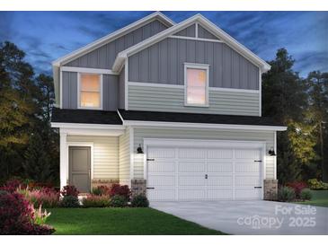 Charming two-story home with a two-car garage and beautifully landscaped front yard at 3013 Summit Oaks Rd, Charlotte, NC 28269
