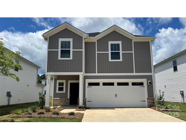 Charming two-story home with a two-car garage and beautiful gray siding at 812 Blue Canyon Dr, York, SC 29745