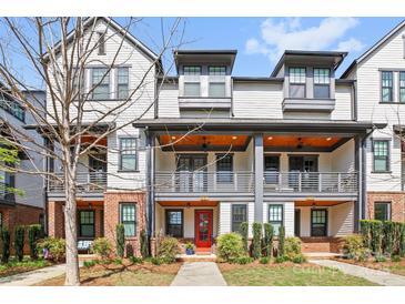 Charming townhome with modern architecture, covered porches, and inviting curb appeal at 921 E 36Th St, Charlotte, NC 28205