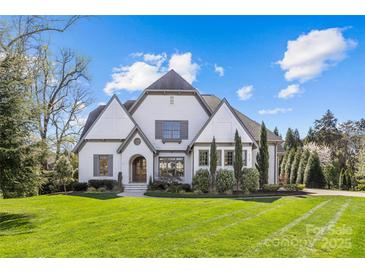 Charming two-story home with manicured lawn and inviting facade, a perfect blend of comfort and curb appeal at 2137 Foxcroft Woods Ln, Charlotte, NC 28211