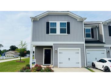 Charming new construction home featuring a one-car garage and craftsman details at 3790 Backwater St, Concord, NC 28027