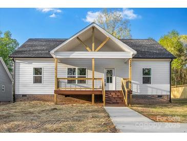 Charming single-story home with a welcoming front porch and a well-maintained yard at 522 Waco Rd, Kings Mountain, NC 28086