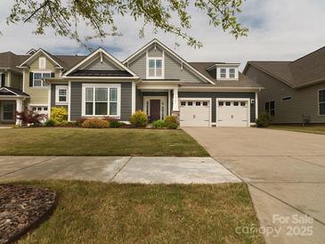 Charming home with a well-manicured lawn and a two-car garage at 18721 Dumbarton Oaks Dr, Cornelius, NC 28031