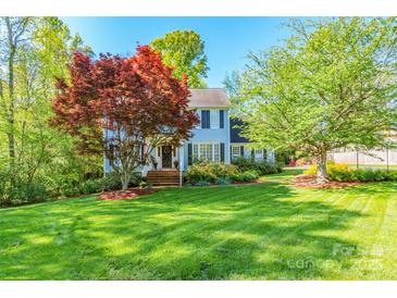 Charming two-story home with a beautiful lawn and mature trees at 2166 Potpourri Pt, Rock Hill, SC 29732