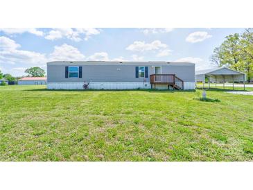 Charming single story home with a well-maintained lawn and a covered parking area at 2923-1 G B Blanton Rd, Shelby, NC 28152